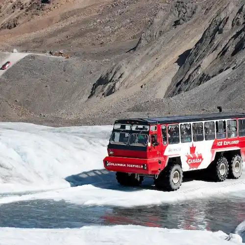 An image of a tour bus driving across the glacier.